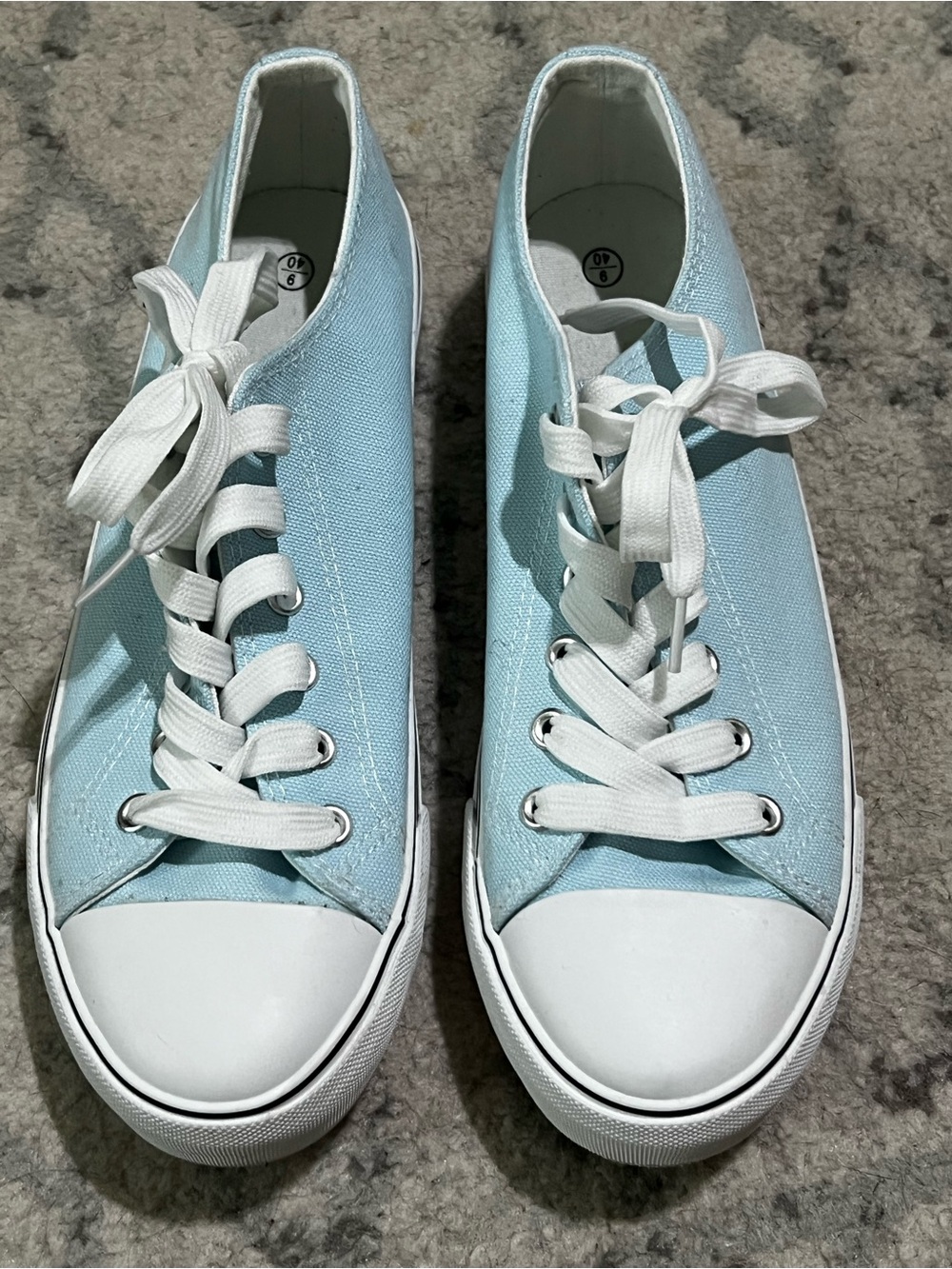 Blue and white canvas shoes